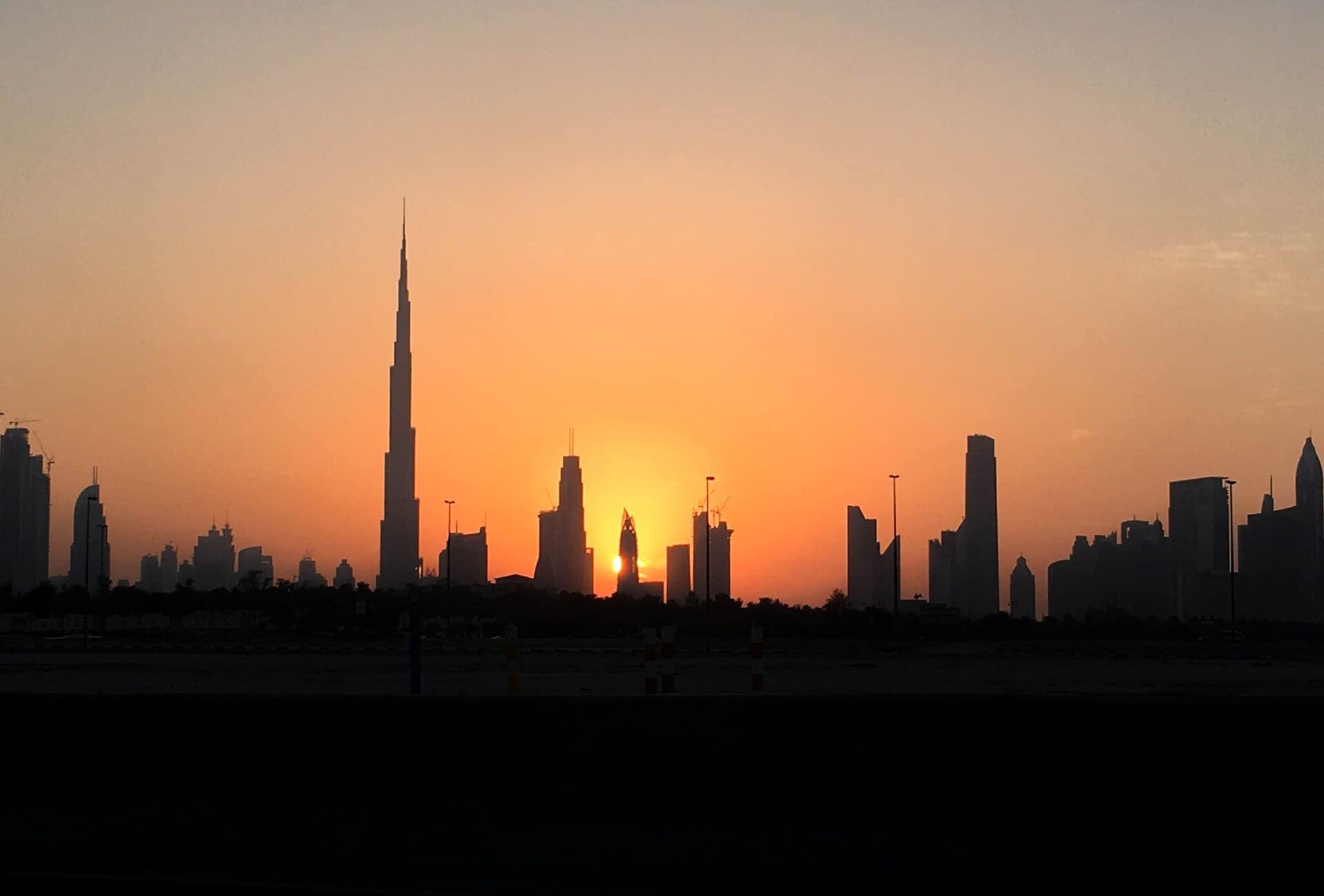 Burj Khalifa silhouetted against a Dubai sunset