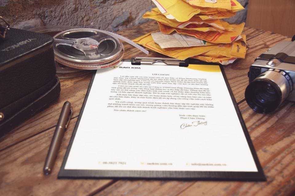 Documents and a pen on a desk